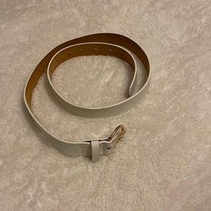 White belt made from faux leather and gold/ metal loop